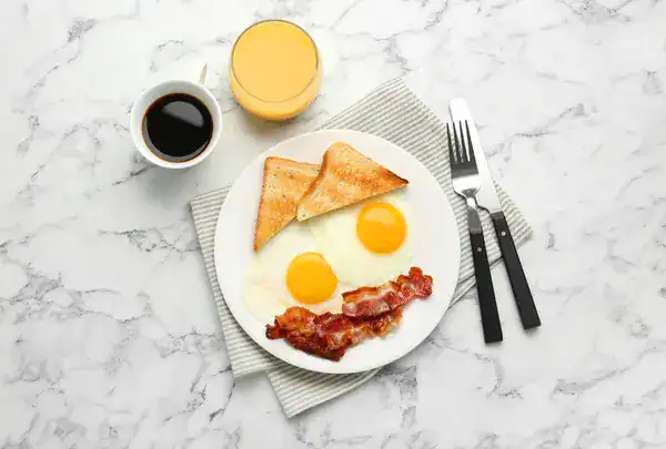 depositphotos_714310582-stock-photo-delicious-breakfast-sunny-side-eggs