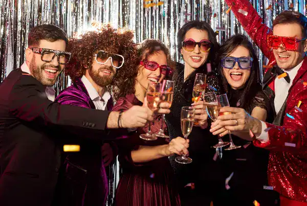 depositphotos_819873964-stock-photo-happy-friends-celebrating-holiday-evening